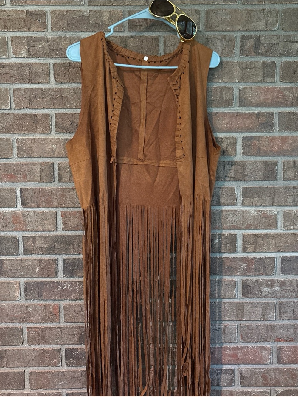 Feelin Groovy 70s Brown faux Suede Fringe Vest and gold sunglasses